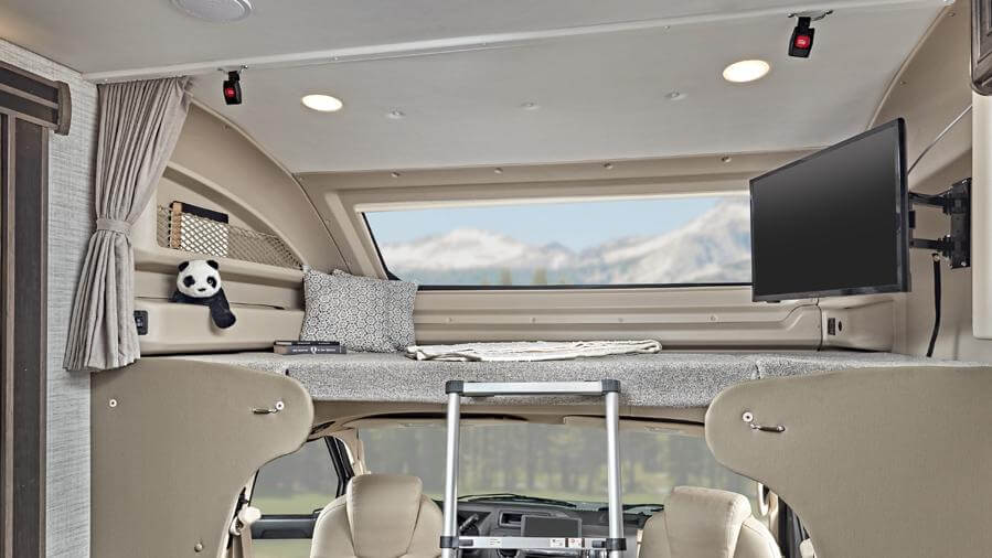 Bunk over cab with personal TVs and front window
